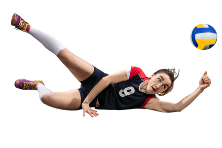 Female volleyball player reaching the ball on the ground isolatedの写真素材