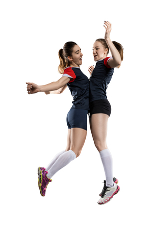 happy female volleyball players isolated on whiteの写真素材