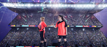 female soccer player celebrating goalの写真素材