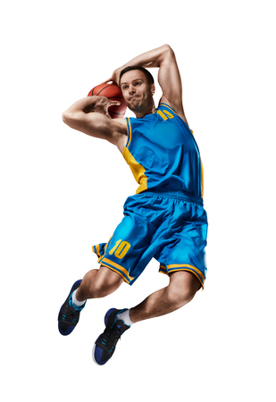 basketball playing making slam dunk isolatedの写真素材