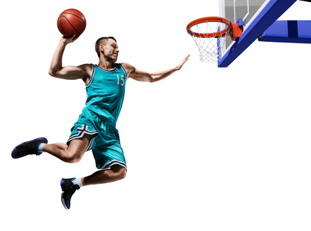 basketball player making slam dunk isolatedの写真素材