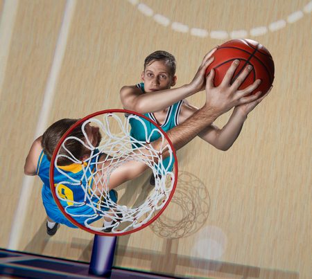 basketball player is blocking shotの写真素材