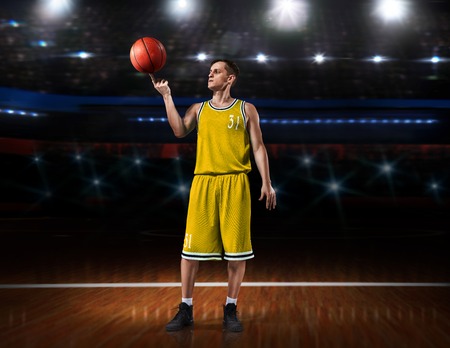 basketball player in yellow uniform standing on basketball courtの写真素材