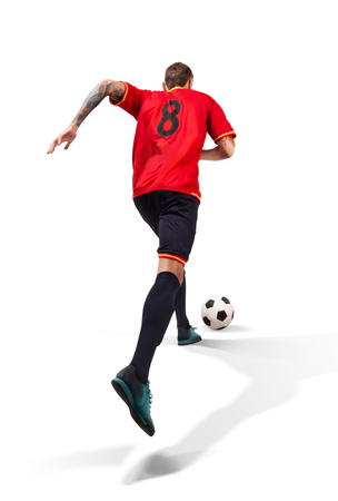 football player running with a ball isolated on whiteの写真素材
