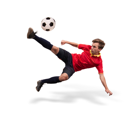 soccer player kicking the ball in the air isolated on whiteの写真素材