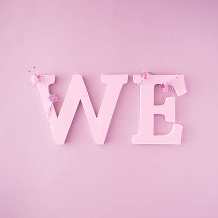 Word WE in monochrome pink color. Minimal Valentine's flat lay composition.の写真素材