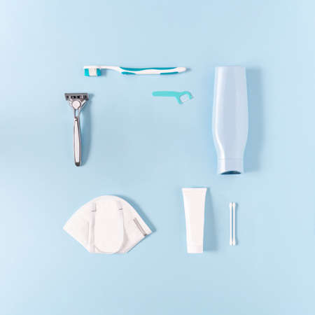 Man's essential cosmetic products on a pastel blue background. Minimal concept, creative pattern idea.の写真素材