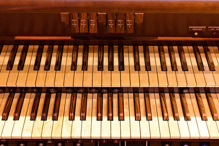 A two manual keyboard on a pipe organ.