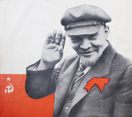 Lenin, in a cap with a bow on the background of the flagのeditorial素材