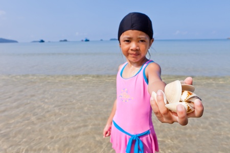 Little cute girl on the beachの写真素材