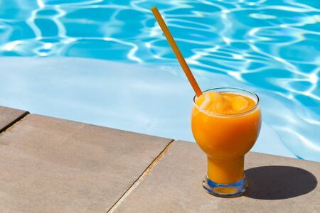 Blended Orange Juice at swimming poolの写真素材