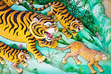 Colorful tigers statue in chinese temple, Thailandの写真素材