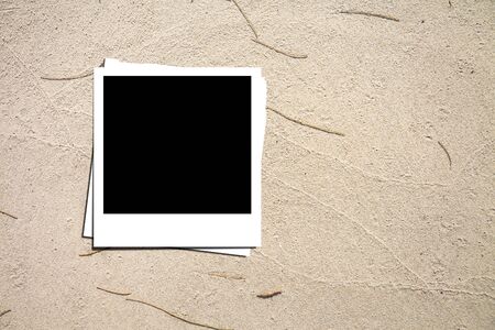 Photo paper on sand backgroundの写真素材