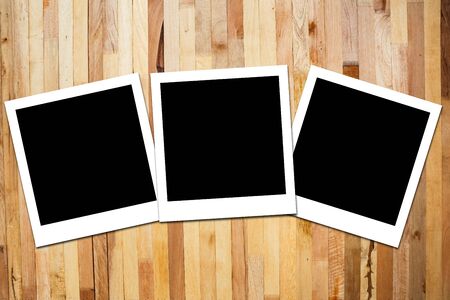 instant photo frame on wooden backgroundの写真素材