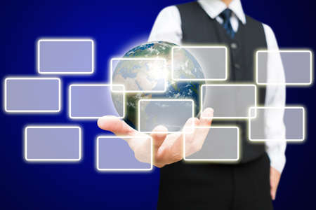 Business man and the digital globe with virtual button, Elements of this image furnished by NASA