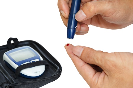 Diabetic lancet device in hand, Isolated over white