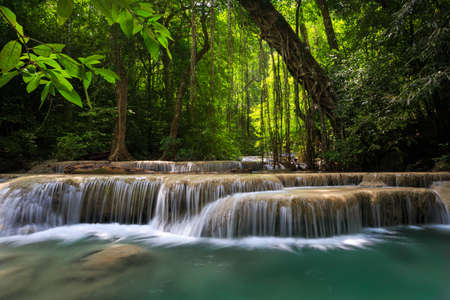 Mountain stream among the mossy stones, Erawan waterfall, Thailandの写真素材