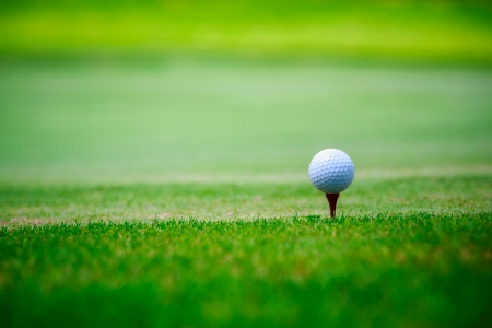 Closeup golf ball on green grassの写真素材