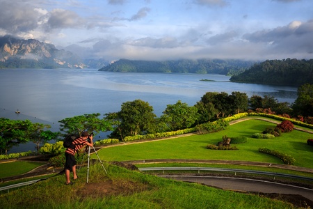 Photographer takes landscape photo