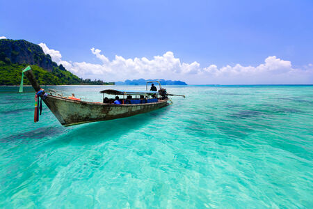 Wooden boat and blue water ocean, Krabi Thailandの写真素材