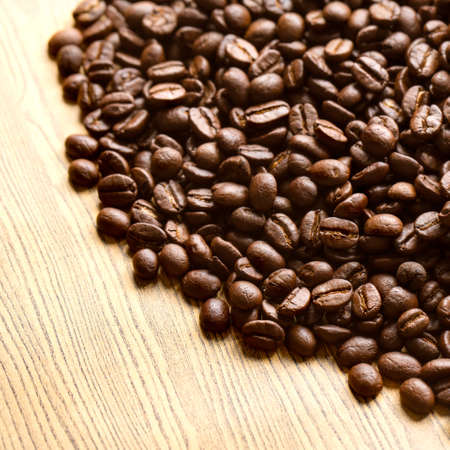 Coffee beans on wooden background
