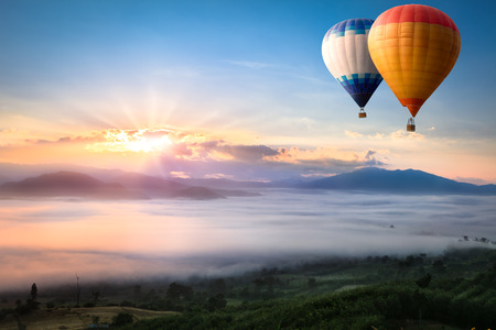 Hot air balloon over sea of mistの写真素材