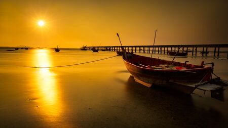 Fishing boat at sunsetの写真素材