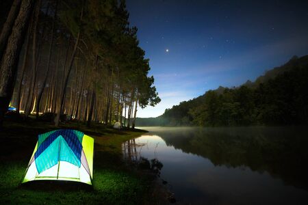 Small Camping Tent Illuminated Inside. Pang Ung, Mae Hong Son, Northen Thailandの写真素材