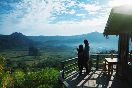 Asian family mother and daughter looking at nature park, Thailandの写真素材