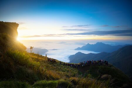Tourist looking sunrise at Phu Chi Fa in Chiang rai, Thailandの写真素材
