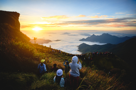 Tourist see sunrise at Phu chi fa in Chiang rai, Thailandの写真素材