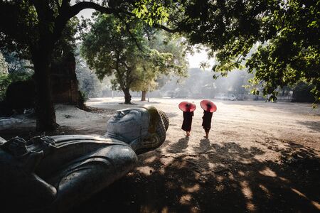 The forgotten buddha, Buddha statue laying on the ground, Mandalay Myanmarの写真素材