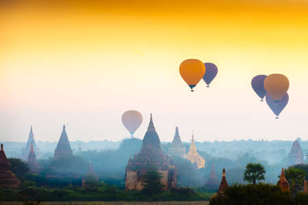 Hot air balloon over plain of bagan in misty morning, Mandalay Myanmarの写真素材