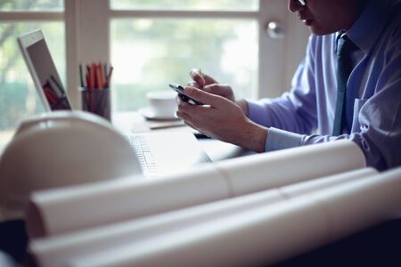 Business man using mobile smart phone make online shopping or payment from officeの写真素材