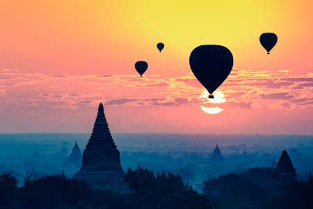 Hot air balloon over plain of bagan in misty morning, Mandalay Myanmarの写真素材