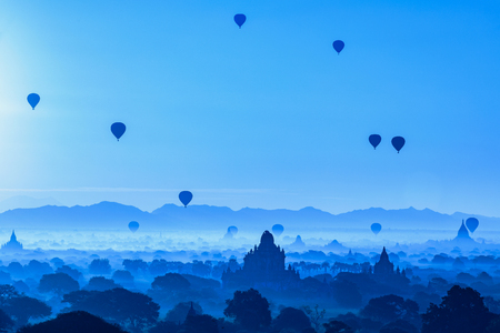 Beautiful sunrise and hot air balloons over ancient pagoda in Bagan is old kingdom in past, Myanmarの写真素材