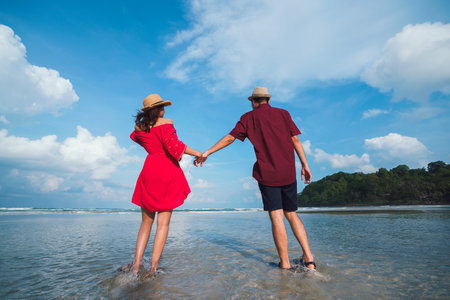 Romantic middle aged couple enjoying beautiful beachの写真素材
