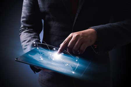 Businessman Holding Digital Tablet With digigal transportaion  Icons, Studio shotの写真素材