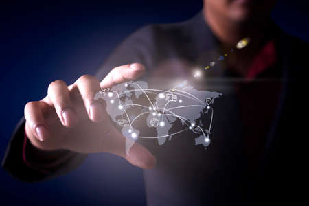 Business man hand showing world transportation  hologram with digital interface technology.の写真素材