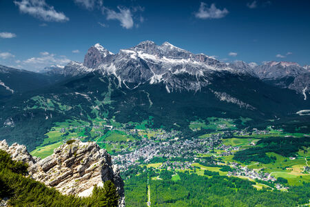 Cortina di A mpezzo and the surrounding mountains viewed at summertime from a nearby mountaintop の写真素材