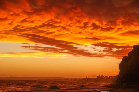 Red storm afternoon on the beachの写真素材