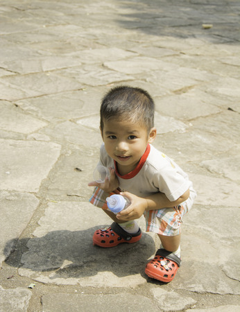 sitting beautiful smiling child, selective focusの写真素材
