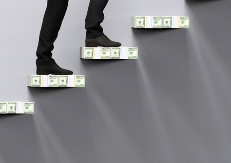 3d rendering. a business man who climbing up on US hundred dollars stack stairs to the success in economic goal.の写真素材