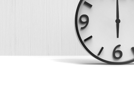 3d rendering. a wake up time at six clock on copy space white wood floor and wall background.