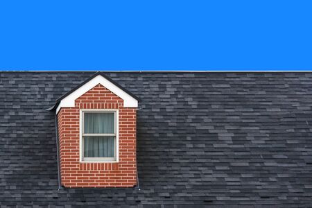 modern vintage gable roof design house wall with clear blue sky background.の写真素材