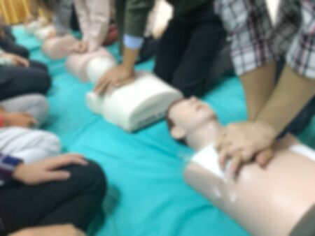 blurred people traning on CPR course for saving another life in emergency case.の写真素材