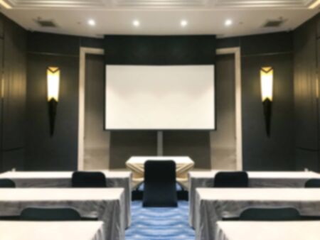blurred empty seminar conference room background.