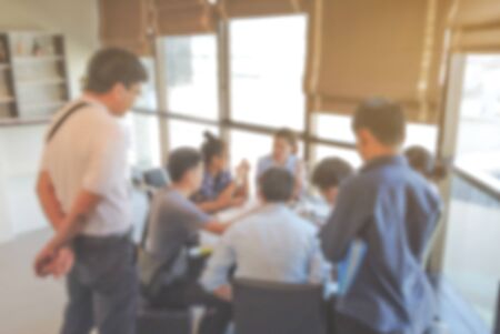 blurred group of people who meeting and talking about new business plan background.の写真素材