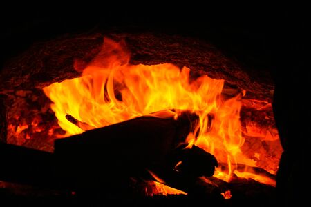 fire burning charcoal in the dark background.の写真素材