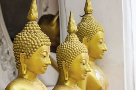 Thai ancient old golden Buddha statue at the temple.の写真素材